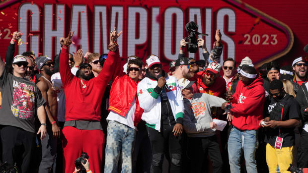 Feb 14, 2024; Kansas City, MO, USA; Kansas City Chiefs defensive tackle Chris Jones (95) addresses the crowd on stage with quarterback Patrick Mahomes (15) during the celebration of the Kansas City Chiefs winning Super Bowl LVIII. Mandatory Credit: Kirby Lee-USA TODAY Sports  